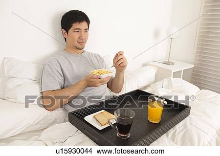 Man having a breakfast View Large Photo Image Picture - Man having a breakfast. Fotosearch