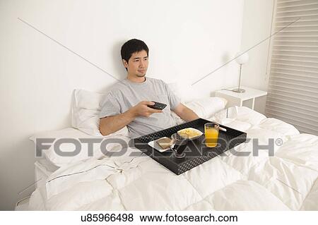 Man having a breakfast View Large Photo Image Stock Photo - Man having a breakfast. Fotosearch