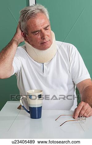 man holding his head View Large Photo Image Stock Photo - man holding his head. Fotosearch