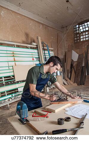 Man in his workshop View Large Photo Image Stock Image - Man in his workshop. Fotosearch