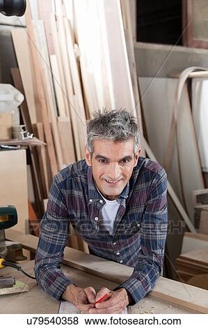 Man in his workshop View Large Photo Image Stock Photo - Man in his workshop. Fotosearch