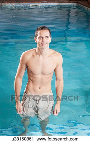 Stock Image - Man in the pool . Fotosearch