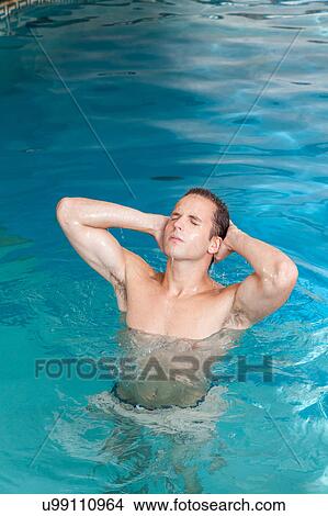 Man inside the pool View Large Photo Image Picture - Man inside the pool. Fotosearch