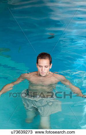 Man inside the pool View Large Photo Image Stock Image - Man inside the pool. Fotosearch