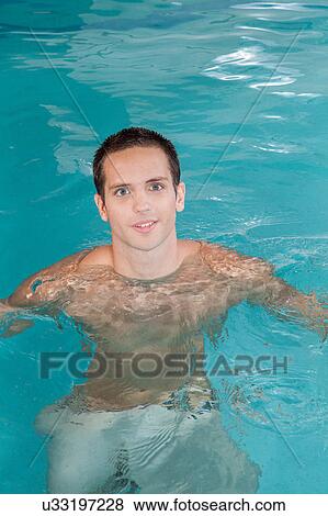 Stock Photo - Man inside the pool. Fotosearch