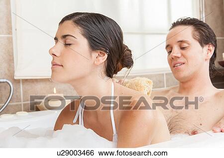Stock Photograph - Man lathering his wife. Fotosearch