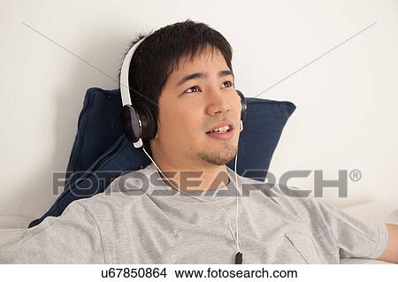 Man listening to music View Large Photo Image Picture - Man listening to music. Fotosearch