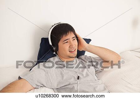 Man listening to music View Large Photo Image Stock Image - Man listening to music. Fotosearch