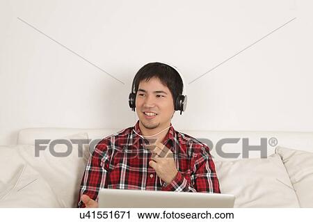 Man listening to music View Large Photo Image Stock Image - Man listening to music. Fotosearch