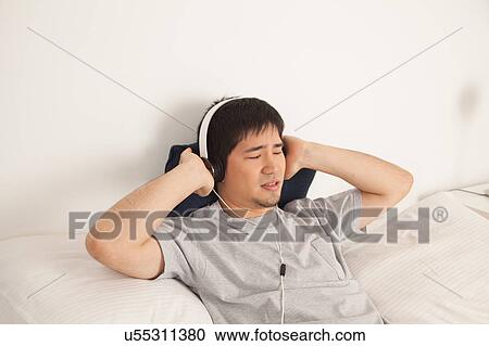 Man listening to music View Large Photo Image Stock Image - Man listening to music. Fotosearch