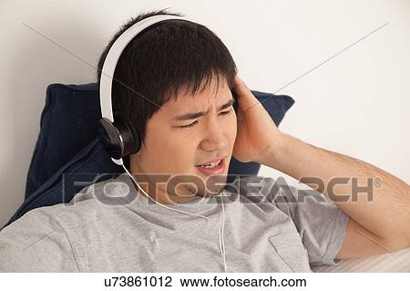 Man listening to music View Large Photo Image Stock Image - Man listening to music. Fotosearch