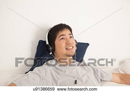 Man listening to music View Large Photo Image Stock Photo - Man listening to music. Fotosearch
