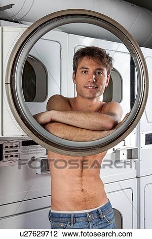 Man looking through the glass View Large Photo Image Stock Image - Man looking through the glass. Fotosearch