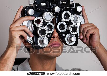 Stock Photo - Man performing studies. Fotosearch