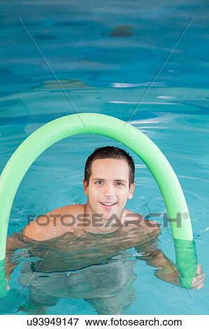 Stock Photo - Man playing inside the pool. Fotosearch