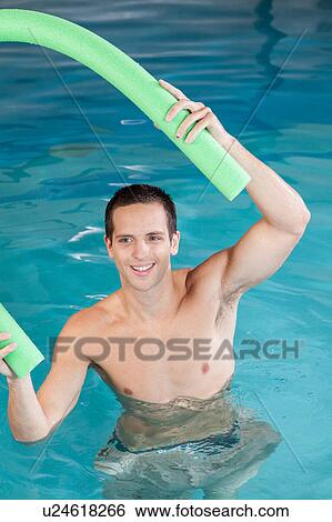 Stock Photograph - Man playing with float. Fotosearch