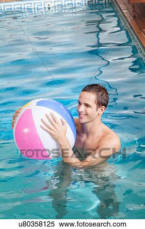 Man playing with inflatable ball View Large Photo Image Stock Photography - Man playing with inflatable ball. Fotosearch