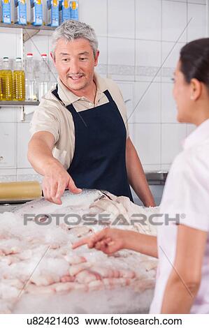 Man pointing a fish View Large Photo Image Stock Image - Man pointing a fish. Fotosearch