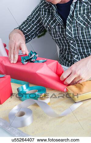 Man preparing gift View Large Photo Image Stock Photo - Man preparing gift. Fotosearch