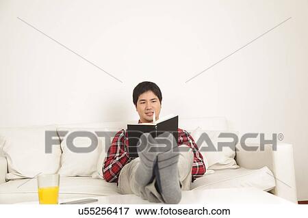 Man reading a book View Large Photo Image Stock Photo - Man reading a book. Fotosearch