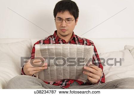 Stock Photo - Man reading the newspaper. Fotosearch