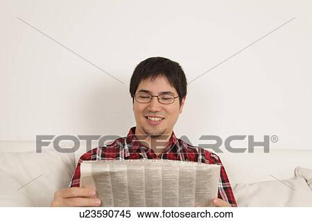 Stock Photography - Man reading the newspaper. Fotosearch