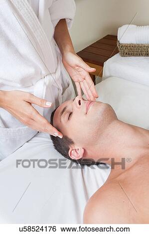Stock Photograph - Man receiving massage. Fotosearch