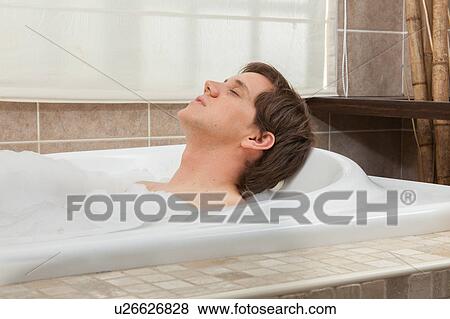 Stock Photo - Man relaxed in the tub. Fotosearch