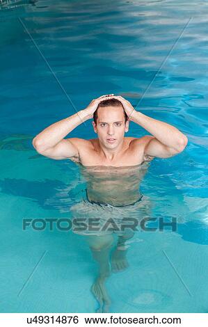 Stock Photograph - Man relaxed inside the pool. Fotosearch