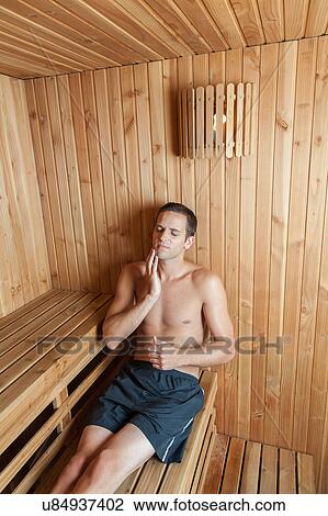 Stock Image - Man relaxed inside the sauna. Fotosearch