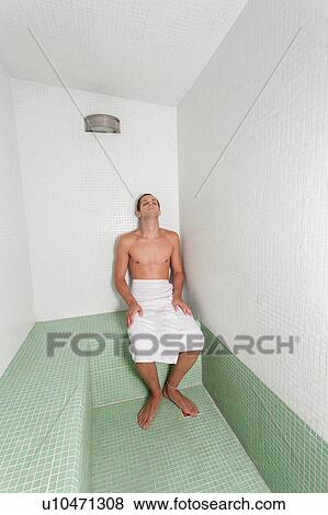 Stock Photo - Man relaxed inside the sauna. Fotosearch