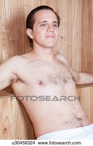 Man relaxing in the sauna View Large Photo Image Picture - Man relaxing in the sauna. Fotosearch