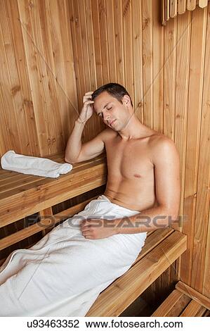 Stock Image - Man rest inside the sauna. Fotosearch
