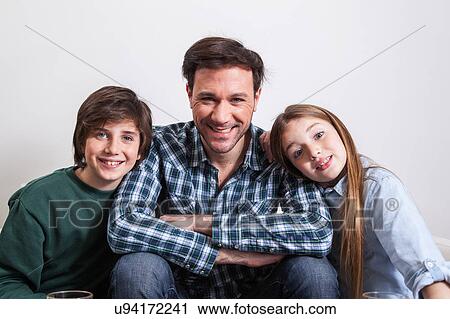 Man sitting with your two sons View Large Photo Image Stock Image - Man sitting with your two sons. Fotosearch