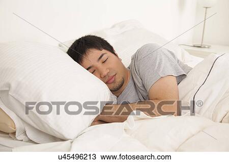 Stock Image - Man sleeping. Fotosearch