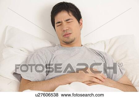 Stock Photo - Man stomach ache. Fotosearch