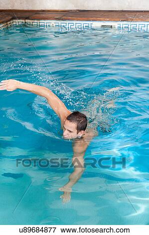 Stock Photo - Man swimming. Fotosearch