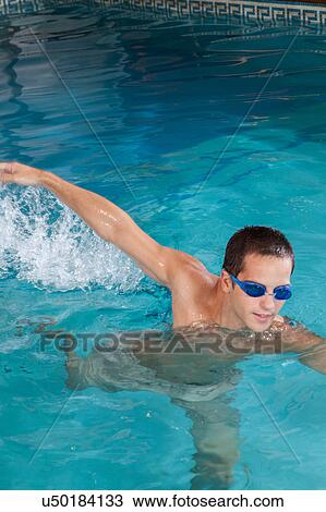Man swimming with goggles View Large Photo Image Stock Image - Man swimming with goggles. Fotosearch