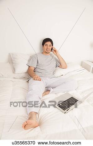 Man talking by phone View Large Photo Image Stock Image - Man talking by phone. Fotosearch