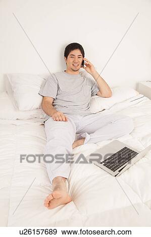 Stock Photo - Man talking by phone. Fotosearch