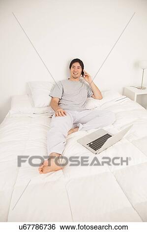 Man talking by phone View Large Photo Image Stock Photograph - Man talking by phone. Fotosearch