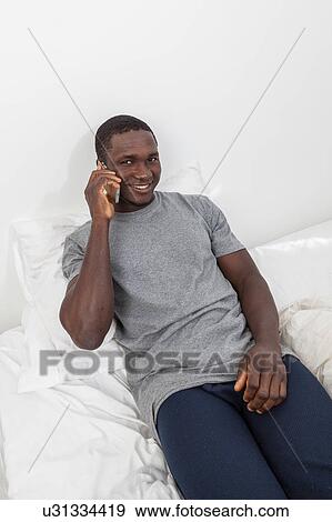 Man talking on the cellphone View Large Photo Image Stock Photo - Man talking on the cellphone. Fotosearch