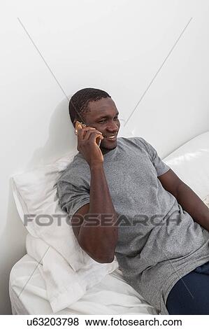 Stock Photo - Man talking on the cellphone. Fotosearch
