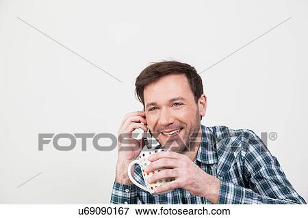 Man talking on the cellphone View Large Photo Image Stock Photo - Man talking on the cellphone. Fotosearch