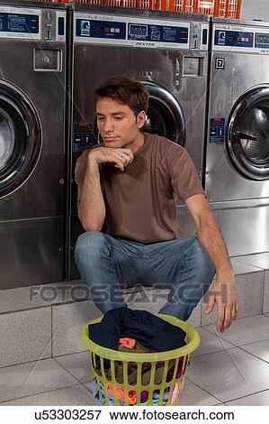 Man thinking in the laundry View Large Photo Image Stock Photo - Man thinking in the laundry. Fotosearch