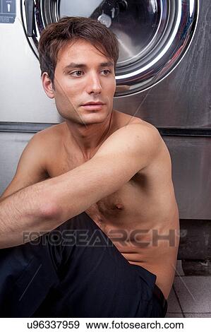 Stock Photo - Man thinking in the laundry. Fotosearch