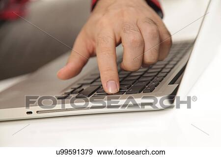 Man touching the computer View Large Photo Image Stock Photo - Man touching the computer. Fotosearch