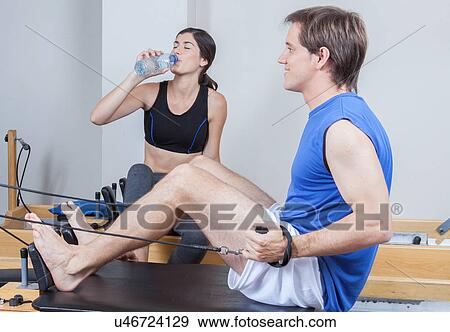 Stock Photo - Man training in pilates. Fotosearch