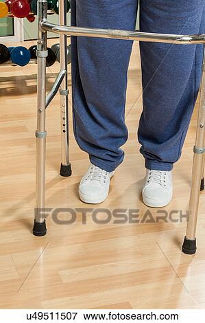 Man using a walker View Large Photo Image Stock Photo - Man using a walker. Fotosearch