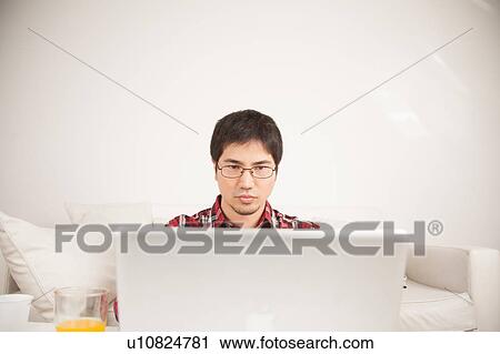 Man using the computer View Large Photo Image Stock Image - Man using the computer . Fotosearch